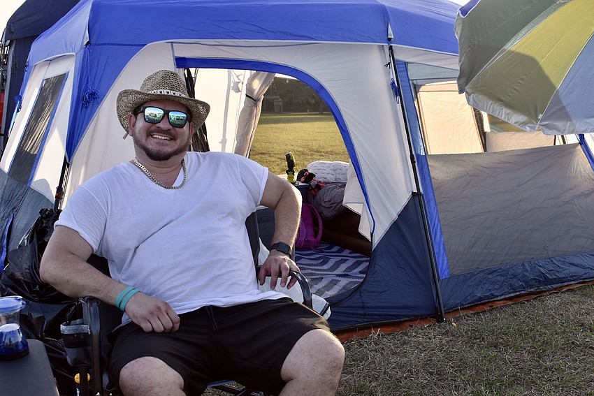 Carlos Sanabria is glamping at the Lakewood Ranch Community Campout. His tent setup includes a carpet, lights, air mattresses and art supplies.