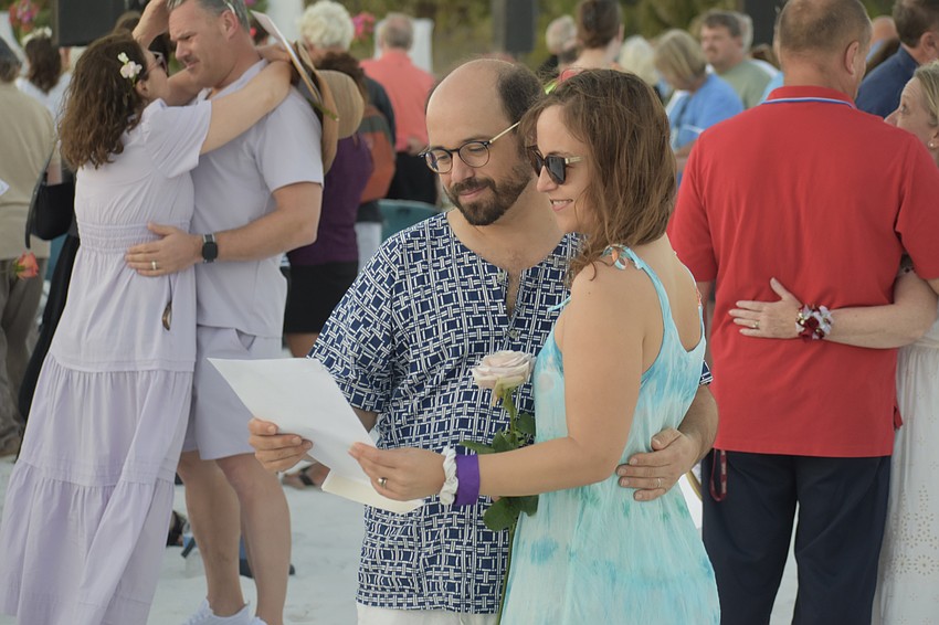 Sarasota's Brandon and Tressa McLeod read their vows. They have been married 13 years.