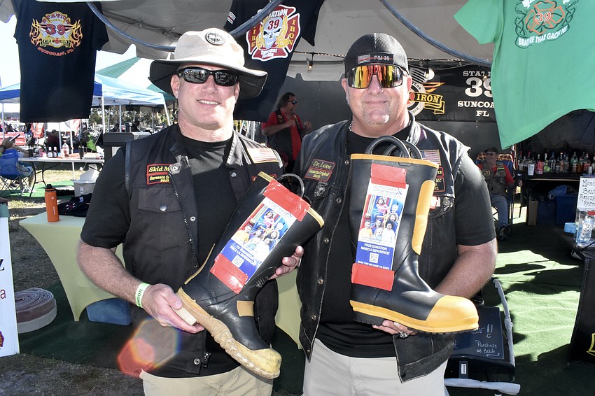 Firefighters Marc Maiure of Station 9 and Scott Love of Station 21 were part of the Fire & Iron Station 39 tent.