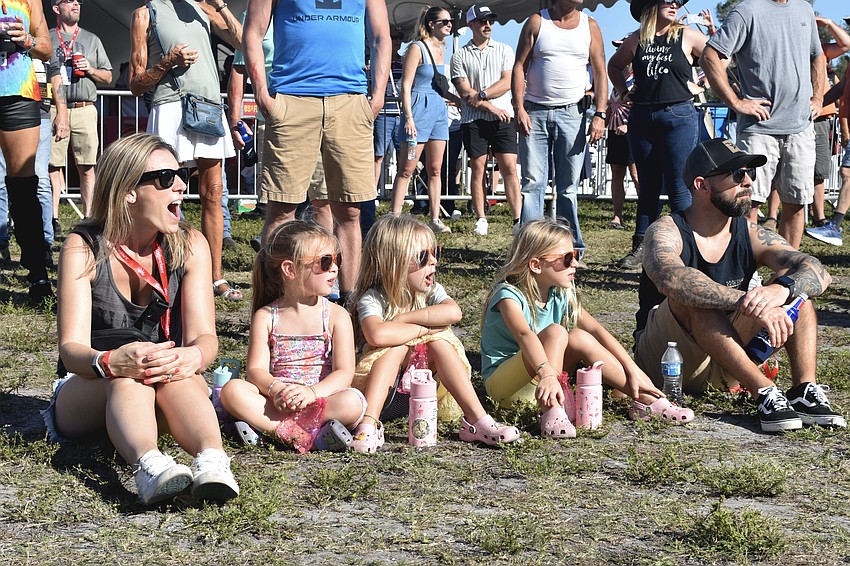 Jenna Poulin, Chloe Poulin, 4, Harper Poulin, 6, Stella Poulin, 6 and Eric Poulin watch the stunt show.