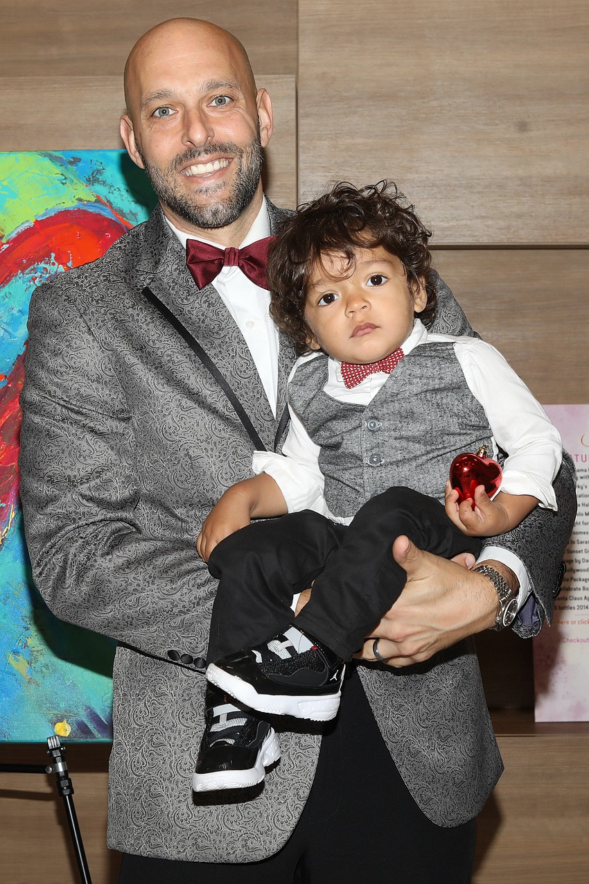 A Big Brother for seven years is incoming chairman of the board Anthony Baldo who takes a photo with his