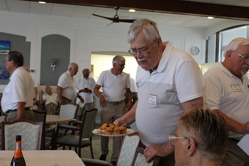 Tom Koch makes his rounds with pastries.