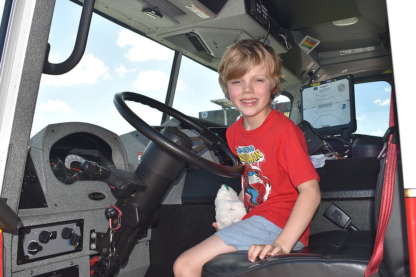 Lakewood Ranch's Logan Anderson, 6, takes a seat in a fire truck.