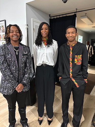 Master of ceremonies Najee Monroe (left) with fellow participants Ashley Harrison and Sheldon Headley at the African American Cultural Society's 22nd annual Youth Black History Celebration. Courtesy photo