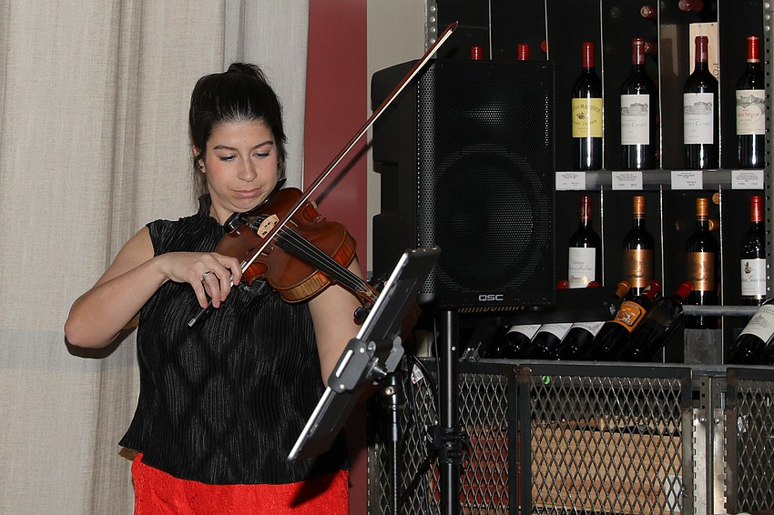 Samantha Bennett with the first violin she purchased and still enjoys playing.