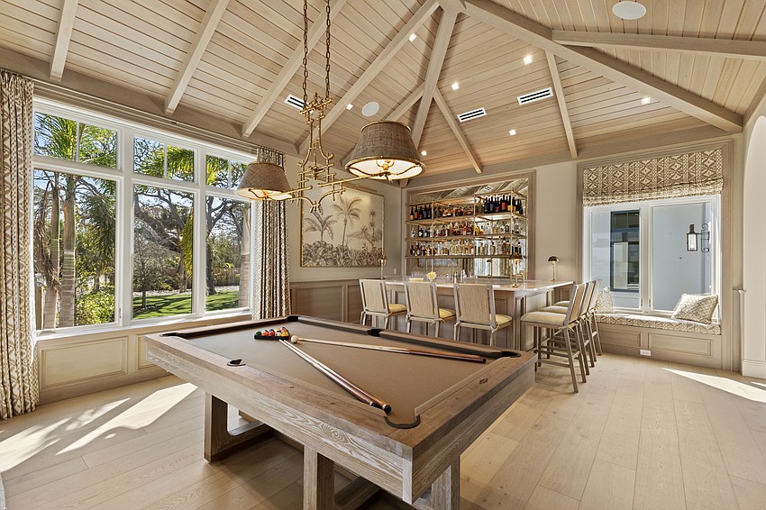 The game room at Crystal Waters includes a wet bar.