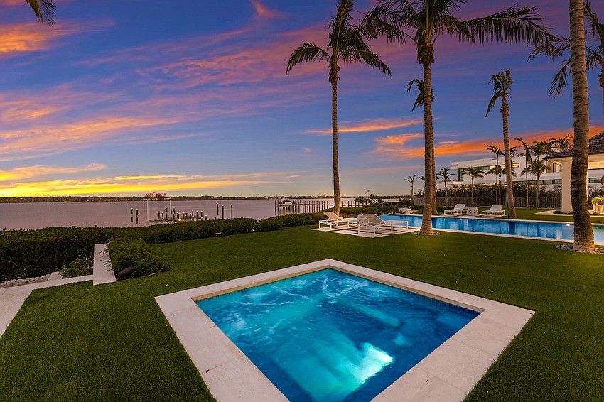 The backyard of Crystal Waters includes a hot tub.