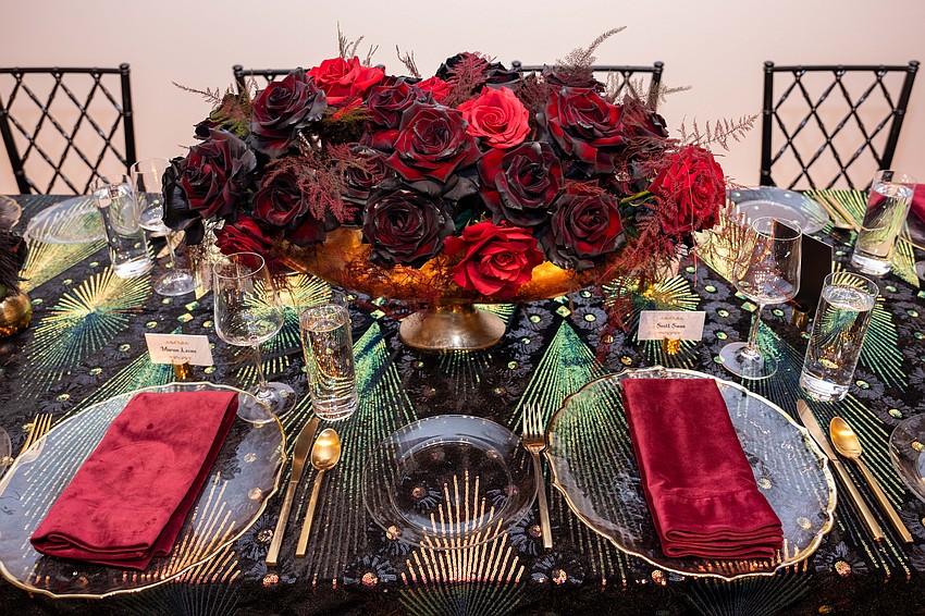 Red rose center pieces and sparkly table settings adorned the space for dinner.