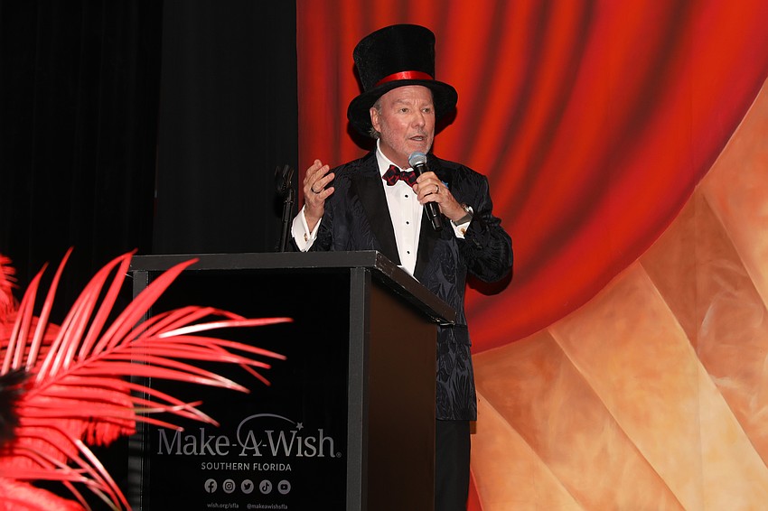 Michael Klauber emcees for Cooking for Wishes.