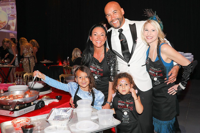 Stephanie and Chris LeDuff with wish-grantor/organizer Amy Frith and two time cancer survivor Libby, 5, and her little sister Elli, 4.