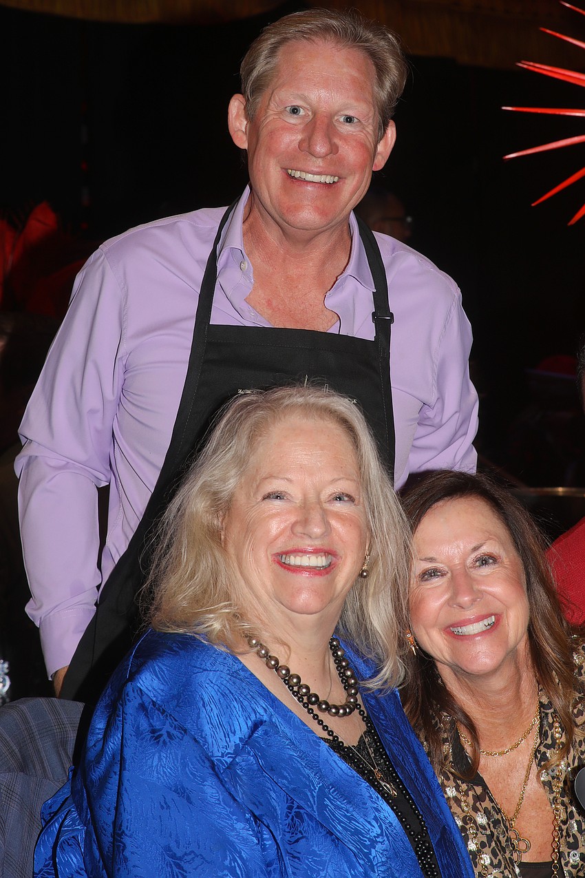 Paul Allen, Linda Shelton and Kim Standish are all smiles as they prepare to cook up a feast to raise money for Make-A-Wish Southern Florida.