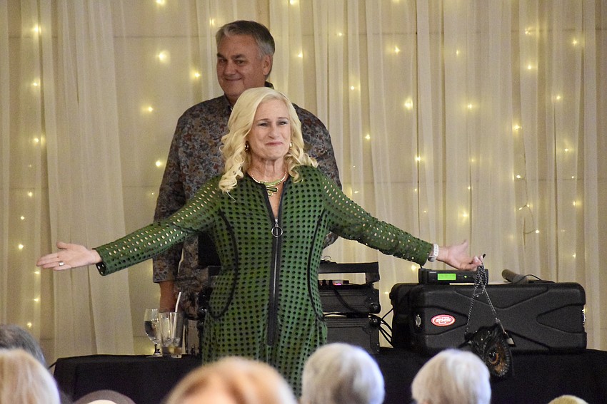 Kay Kwenski shows off a green jumpsuit to a crowd of about 140.
