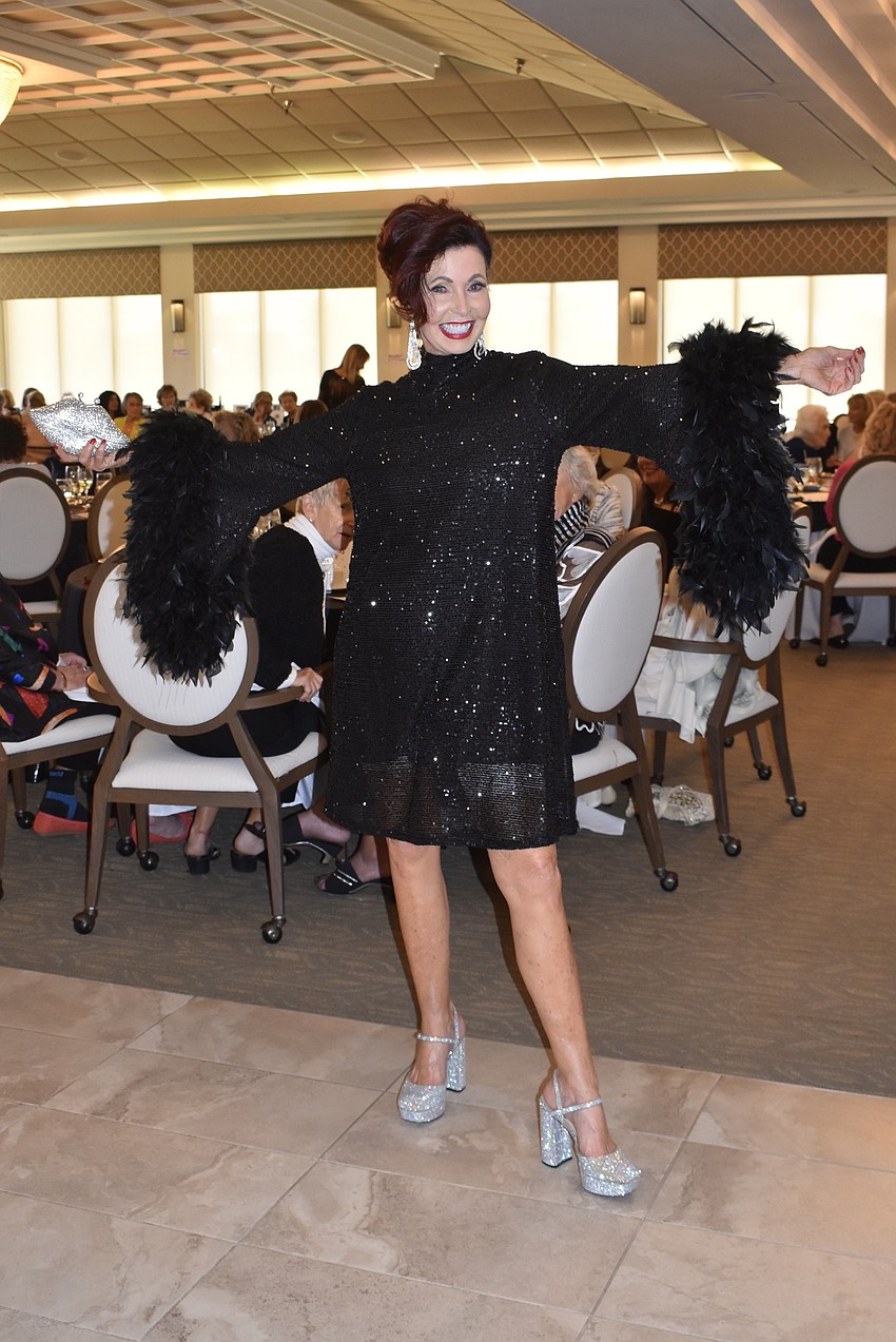 Katherine Pike's sleeves are trimmed with ostrich feathers.