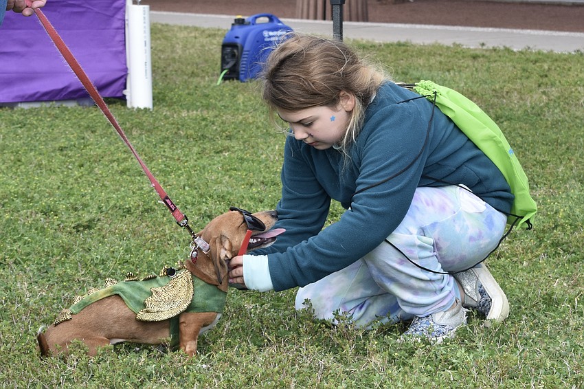 Georjann Danke, 9, puts glasses on Phoebe.