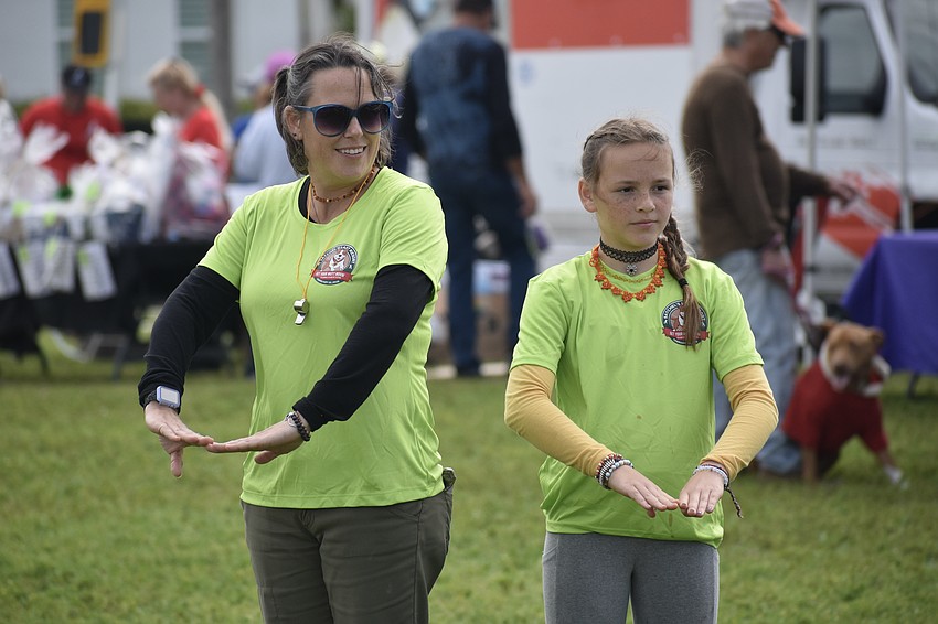 Ashley Logston and her daughter Juliet Logston, 12, participate in a hula session.