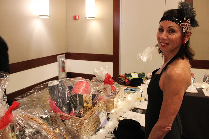 Sarasota's Rita Thibault checks out silent auction items at All That Jazz: Cabaret for a Cause.