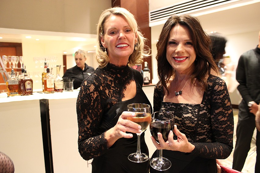 Sarasota's Kelly Fox and Tara's Melissa Wandall enjoy a drink before All That Jazz: Cabaret for a Cause on Feb. 21 at the Hyatt Regency in Sarasota.