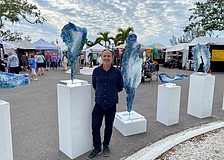 Artist John Denis displays his sculptures at the Longboat Key Festival of the Arts in Sarasota County.