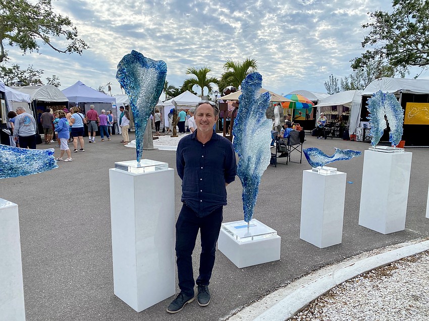 Artist John Denis displays his sculptures at the Longboat Key Festival of the Arts in Sarasota County.
