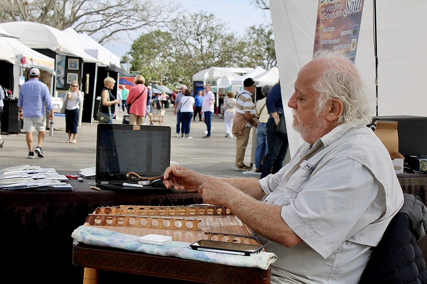 Musician Vladimir Gorodkin plays the hammer dulcimer.