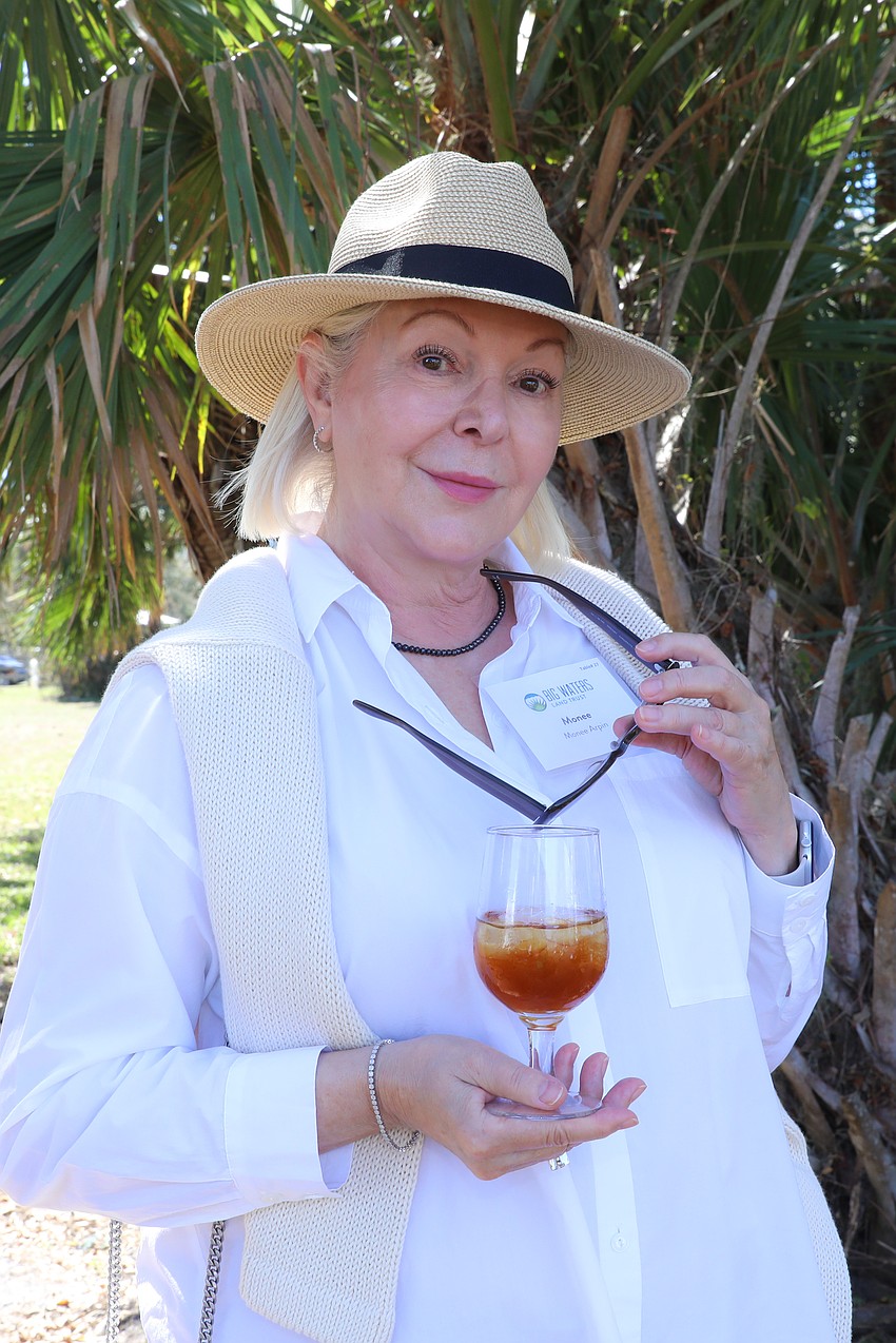 Monee Arpin enjoys a true garden party supporting Big Waters Land Trust in North Port.