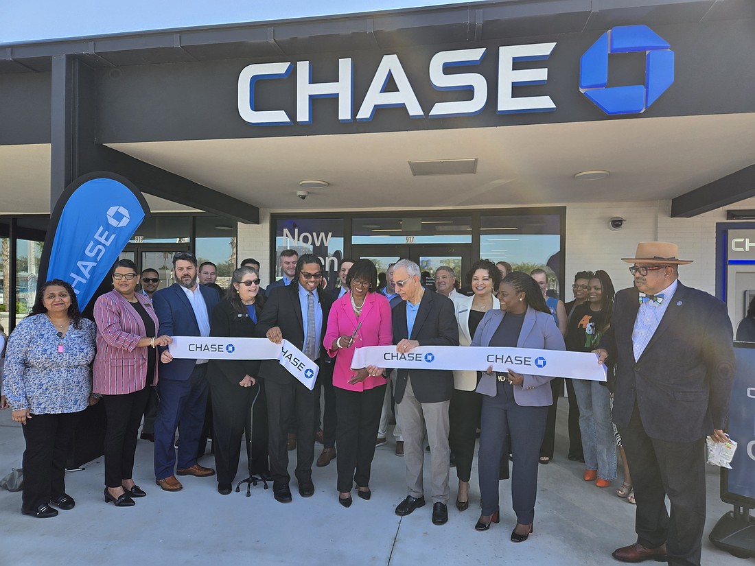 Duval County Appraiser Joyce Morgan cuts the ribbon Feb. 26 at Chase Bank in College Park, the former Town & Country Shopping Center, at northeast University Boulevard and the Arlington Expressway in Arlington near Downtown. At her right is Jacksonville City Council member Ron Salem.