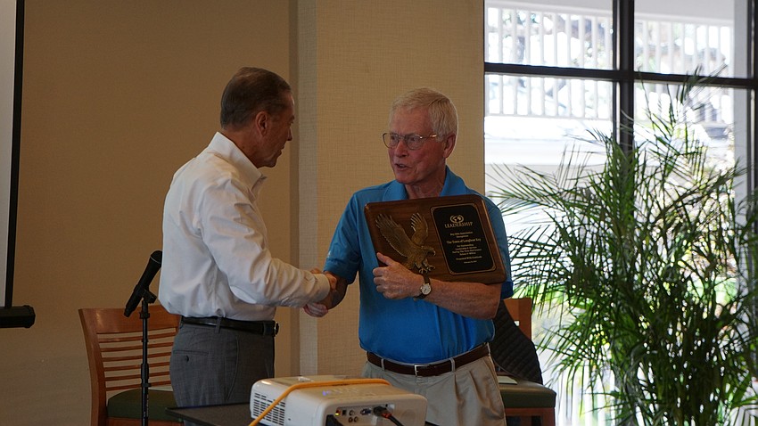 Mayor Ken Schneier accepted an award on behalf of the town commission, presented by H. Joseph Reiser.