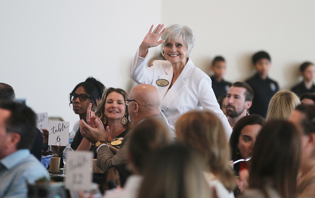 Volusia County School Board member Donna Brosemer greets the crowd during the district's first State of Our Schools address on Thursday, Feb. 27. Photo by Jarleene Almenas