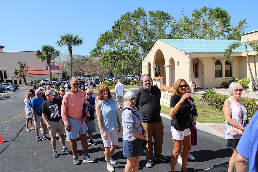The line to enter the St. Mary, Star of the Sea, Catholic Church annual rummage sale extends around the hall at the Friday morning kickoff.