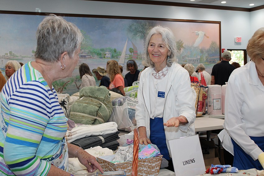 Jolana Popcack lends a helpful hand in linens.