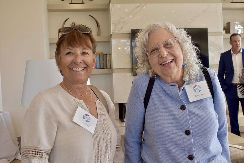 Paula Olsen and Margie Meyer are club members. Meyer spent her career in finance, but took up abstract painting about 20 years ago. When Hope Family Services updated its domestic violence shelter, Meyer donated over 20 of her paintings.