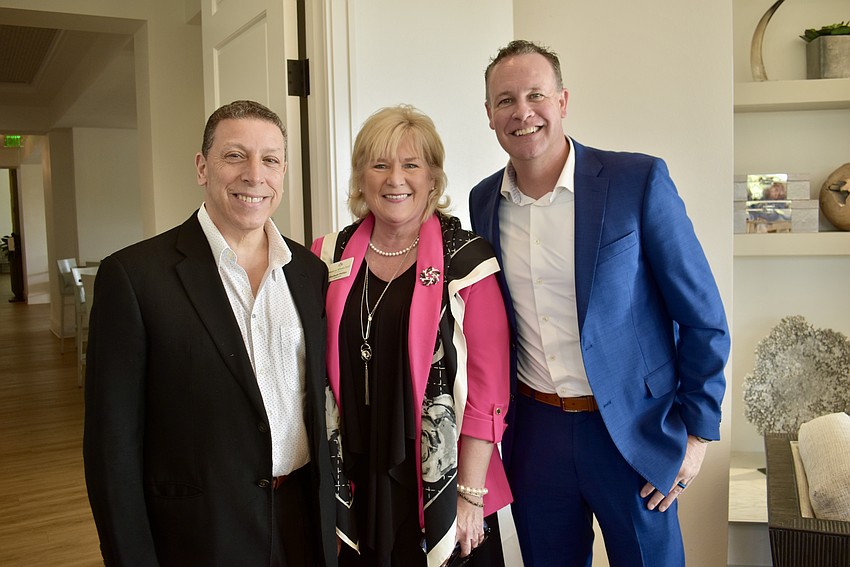 Joe Najmy, Maribeth Phillips and Jared Hermann chat during the cocktail hour.
