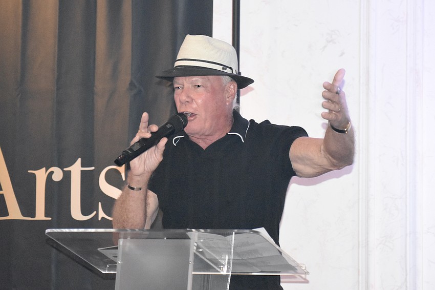 Les McCurdy, owner of McCurdys Comedy Theatre, leads the auction.