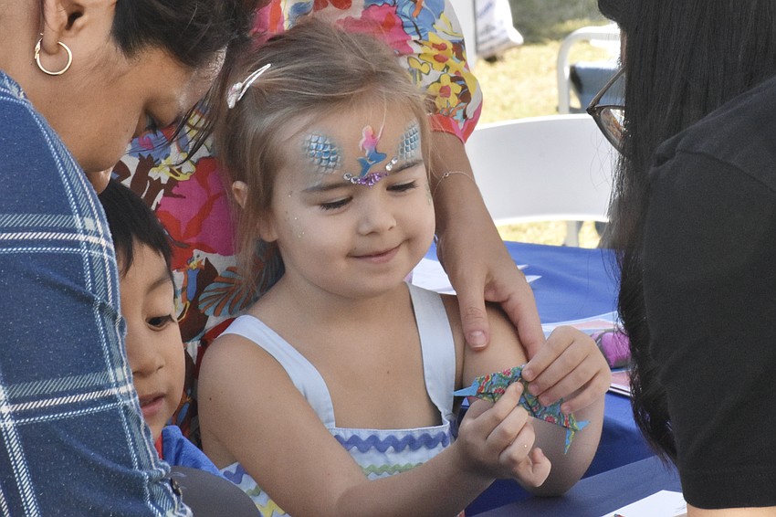 Nika Slovieva, 4, completes a craft project.