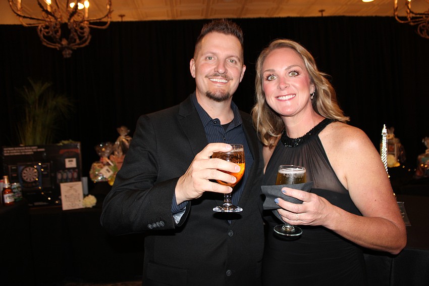 Clinton and Jennifer Faulkner of Parrish enjoy a cocktail at Tropical Nights.