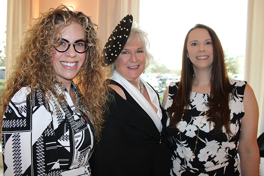 Meals on Wheels Plus Board Member Melissa Gould, CEO and President Maribeth Phillips and Board Treasurer Susan Kramer were grateful for another smashing turnout at Tropical Nights.
