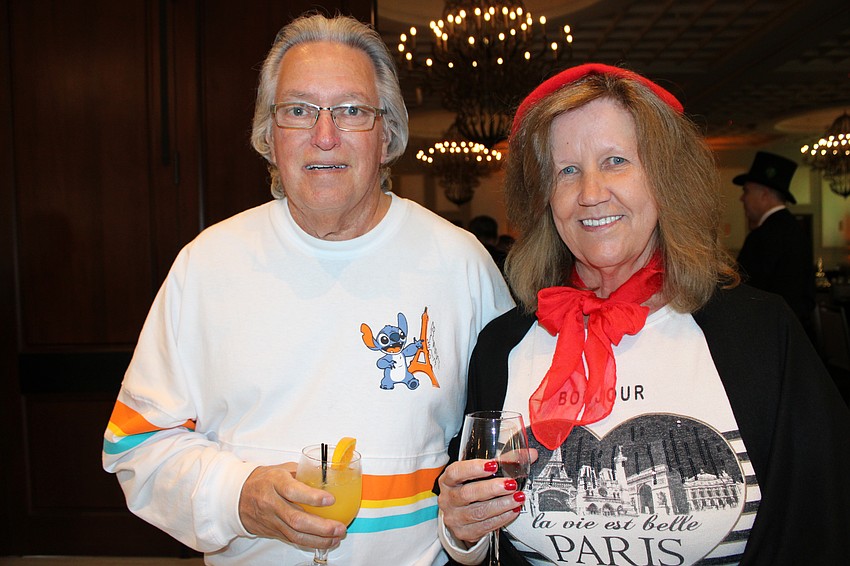 Bradenton's Blair and Debbie Smith had some snappy attire to wear at Tropical Nights Under Paris Lights at the Grove. Blair was forced to buy his Disneyland Paris shirt after the airline lost his luggage.