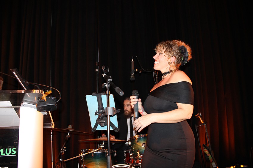 Sarah Fleener of the band Tropical Avenue entertains the crowd during Tropical Nights.