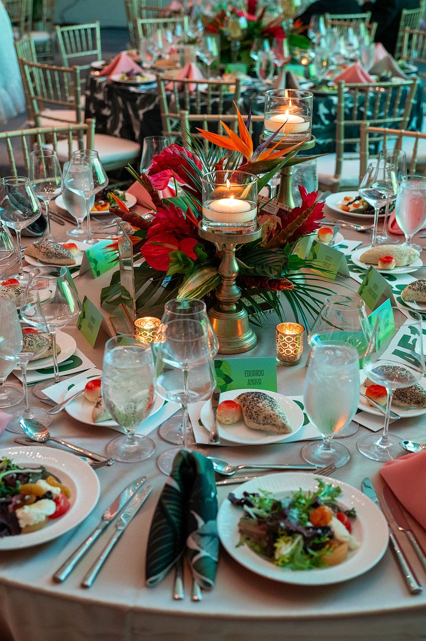 The event featured tropical table settings.