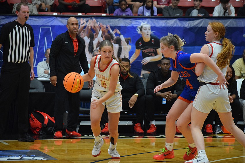 Cardinal Mooney junior guard Talia Busser works around a screen set by teammate Riley Martin against Bolles in the 3A state championship game March 1.