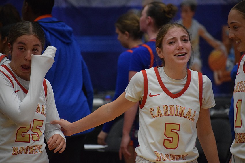 Cardinal Mooney girls basketball players Avery Davis and Josie Maloni can't hold back tears after winning the 3A state championship March 1 at RP Funding Center in Lakeland.