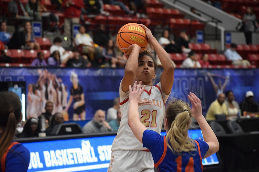 Cardinal Mooney senior Kali Barrett rises up for a shot against Bolles guard Abby Knauff in the 3A state championship on March 1 at RP Funding Center in Lakeland.