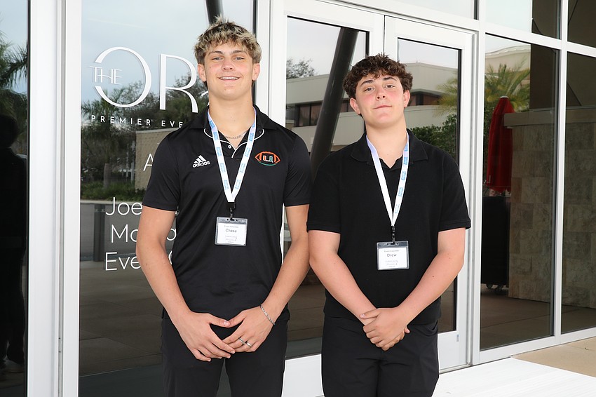 Brothers Chase and Drew Smith greet guests.