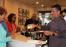 Bartender Sam Lastinger keeps the party going at Taste and Tunes of the Keys.