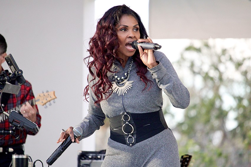 Latraia Savage, singer with Big Z Band, helps kick off the latest Savor the Sounds concert series.