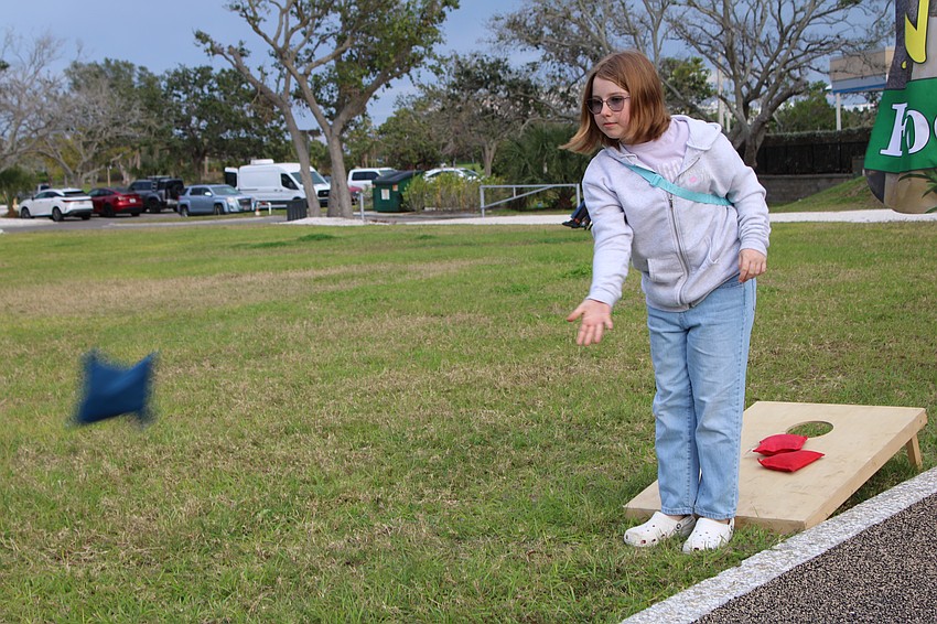 Ellen Snyder, pictured, squares off against Allyn Snyder in a round of bean bag toss.