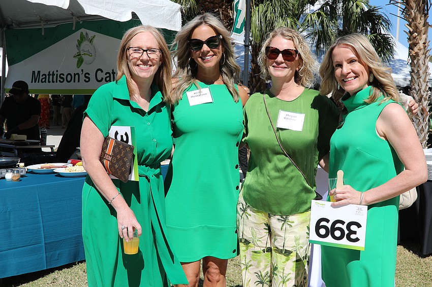 Jennifer McAfee, Kristi Hoskinson, Megan Kitchner and Jennie James are color-coordinated for the USF Brunch on the Bay!
