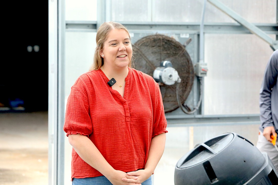 Flagler Palm Coast agriscience and agritechnology instructor Maggie Reaves talks on camera in the FPC greenhouse for a Flagler County Education Foundation video. File photo by Brent Woronoff
