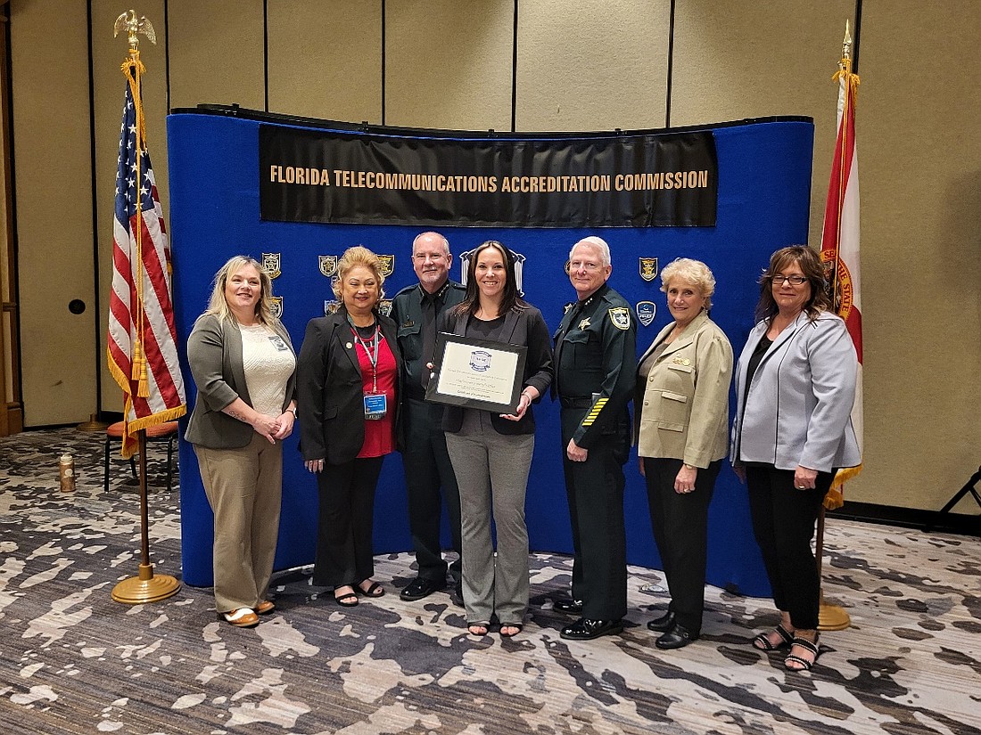 Flagler County Sheriff Rick Staly and the Flagler County Sheriff’s Office team accept reaccreditation from the Florida Telecommunications Accreditation Commission. Courtesy photo