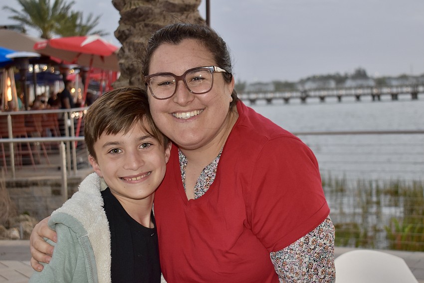 Tara Elementary's Luca Riccio runs into his former teacher Alex Miranda at Ranch Nite Wednesday.